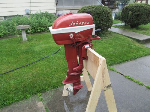 Vintage 1956 seahorse 10 outboard motor with pressurized fuel tank.