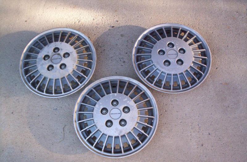 86  pontiac  grand am  set  of  3  hubcaps   --check this out--
