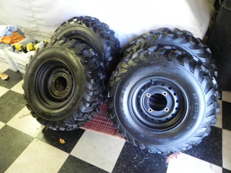 Brand new set of 4 maxxis tires on steel rims from kawasaki teryx