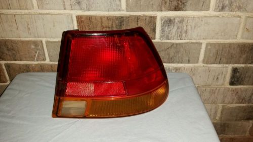 Used oem saturn s series passenger side right rear taillight