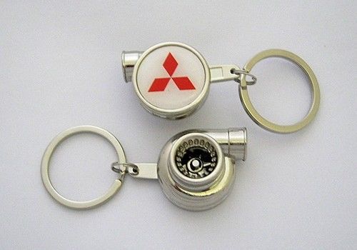 Spinning turbo keychain with mitsubishi dsm logo