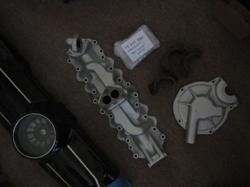 1949 ford manifold, timing cover, camshaft cover plate, etc.
