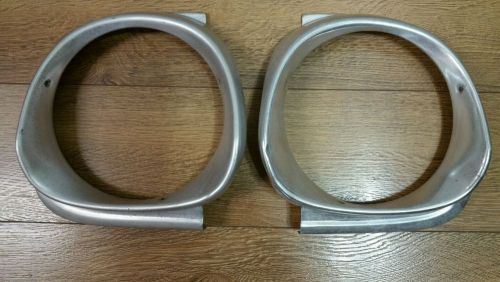 Used pair of 1962 ford falcon headlight bezels oem right side and left side.
