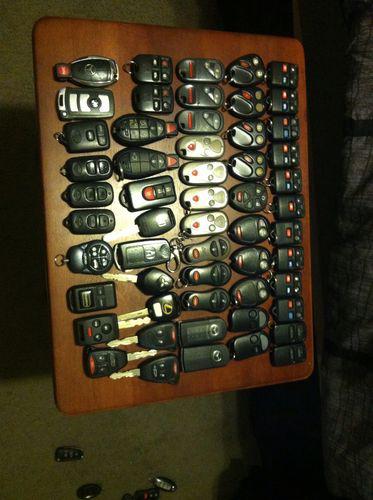Lot of keyless entry remotes and fobs ford gm honda toyota