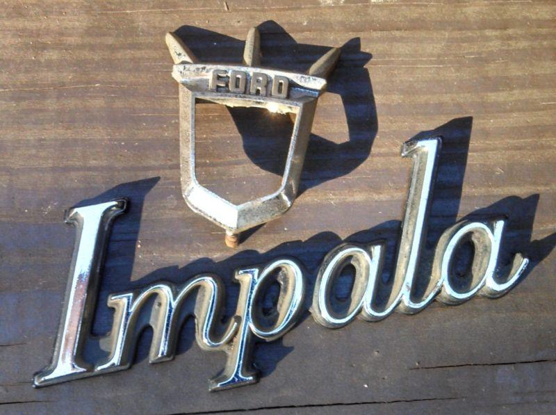 Vintage ford and impala metal emblems