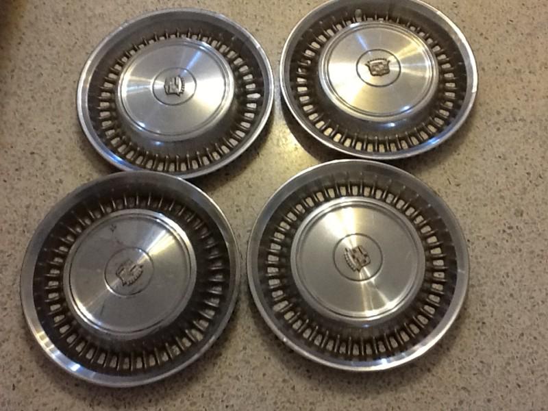 Blow-out sale...set of 4 vintage cadillac hubcaps (16.25" diameter)