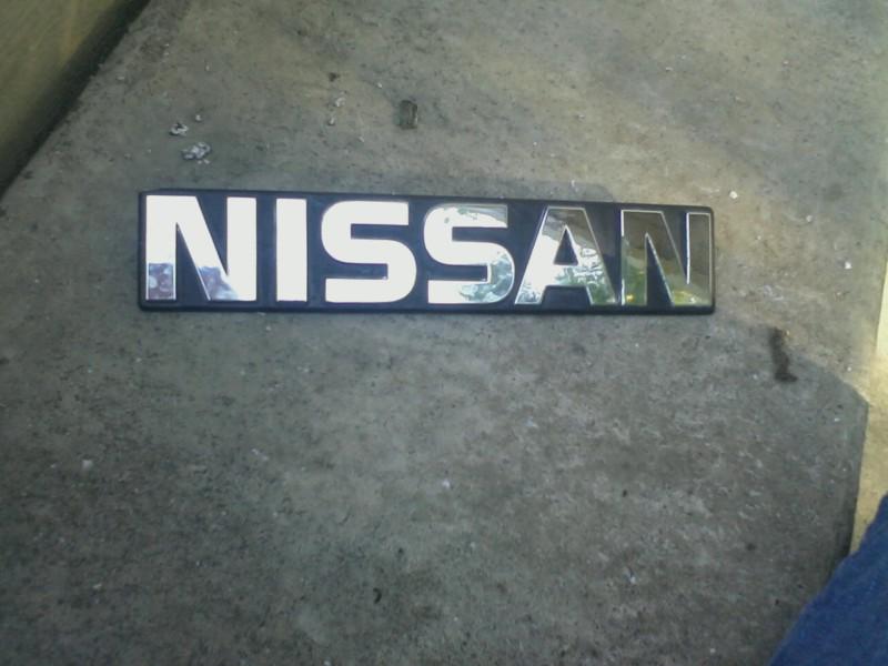 1980's nissan pick up truck fender emblem