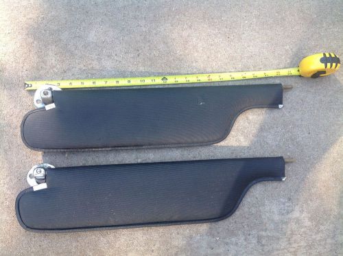 Two 1968-1969 oem chevelle sun visors and supports black ribbed