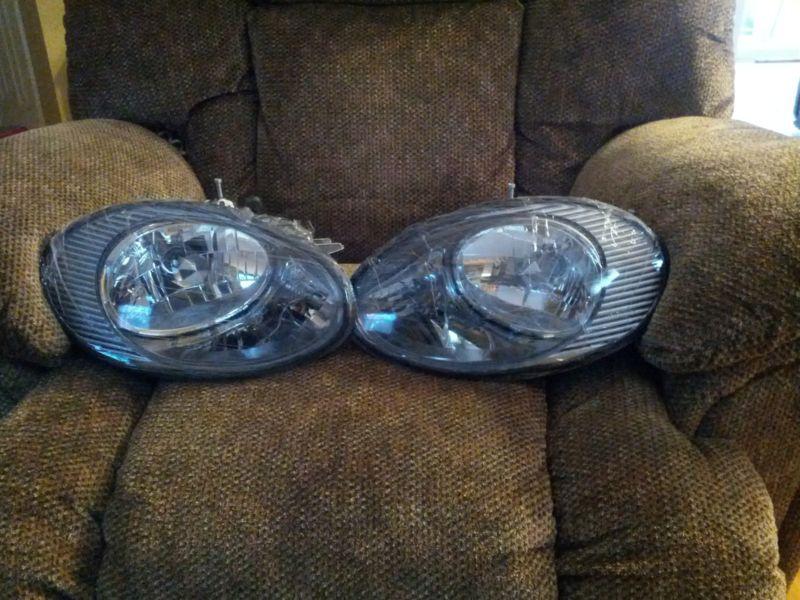 Eagle eyes ford taurus  headlights  (pair) new