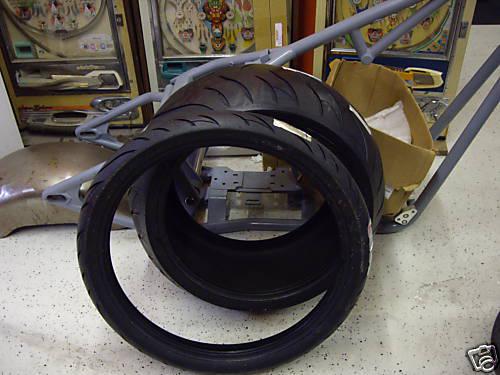   a  pair of avon cobra tires 300/35r-18 & mh90-21