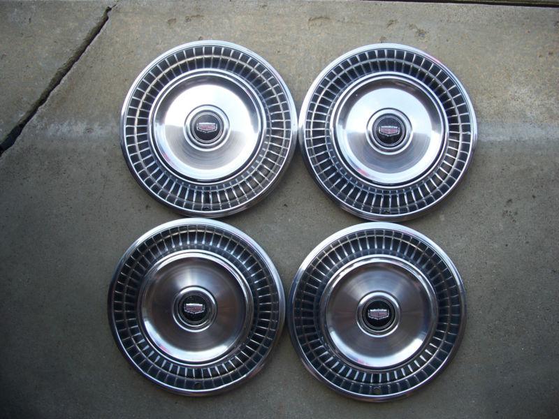 Late 70's early 80's cadillac general motors 14" wheel covers hub caps set of 4