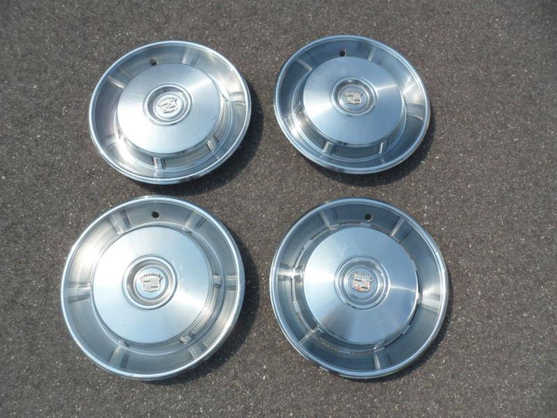 1965-1967 cadillac hub caps set of four **nice**