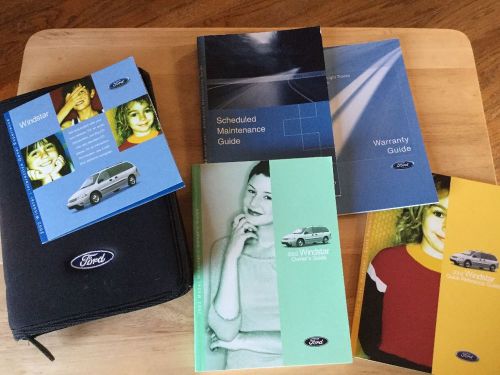 Ford windstar 2002 owners manual with case and cd. 4 books cd and case. all very