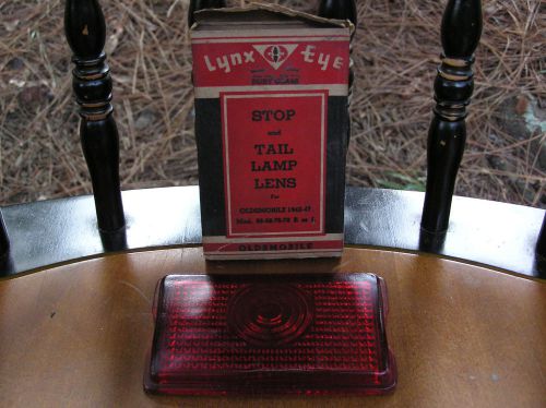 One oldsmobile stop &amp; tail lamp lens 1942 - 1947 glass lynx eye - new with box