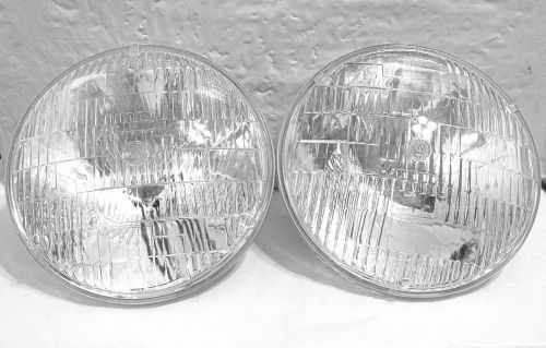 Pair of sealed safe-t-beam 12v headlamps with aimer buttons by westinghouse, nos