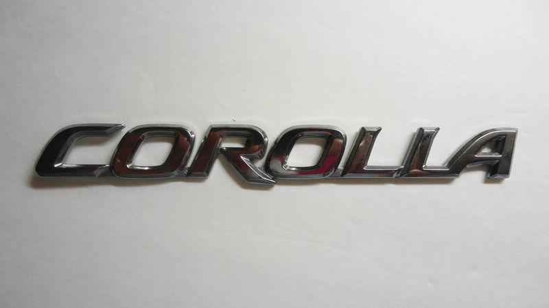 Used oem toyota "corolla" emblem fits trunk lid 03-08 7544202070 75442-02070