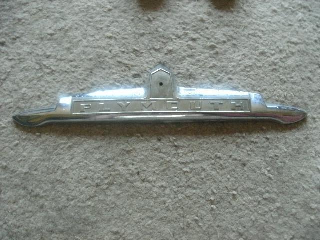 1949 plymouth trunk ornament part no. 1246986 has some pit marks