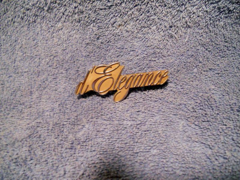 D' elegance script metal emblem used genuine gm part # 9728073 cadillac 