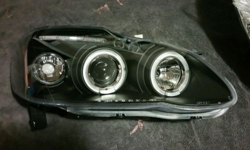 03-08 toyota corolla halo projector led black headlight (passenger side only)