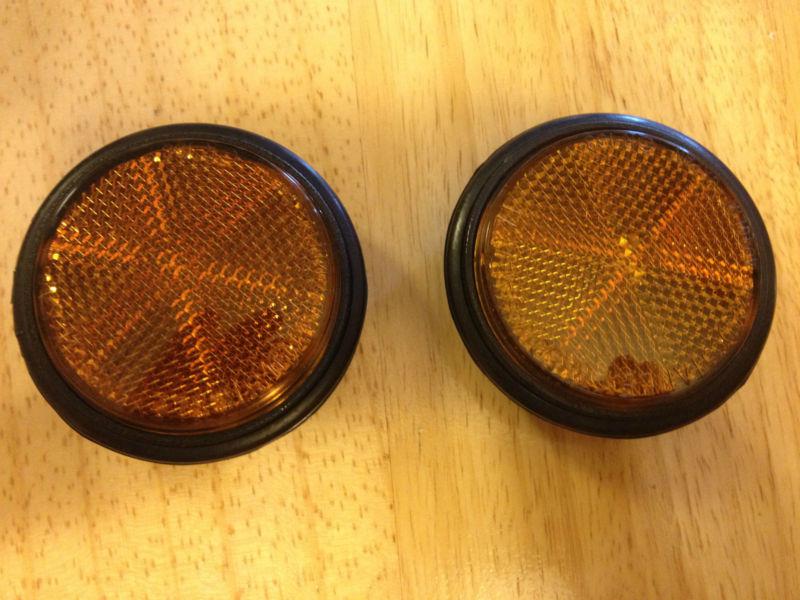 1982 honda ft500 ascot reflecters that mounts to headlamp bezel head light