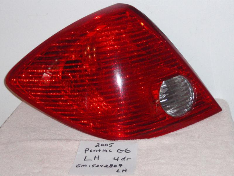 Used 05 pontiac g6 2005 tail light lamp drivers side lh gm 1524809