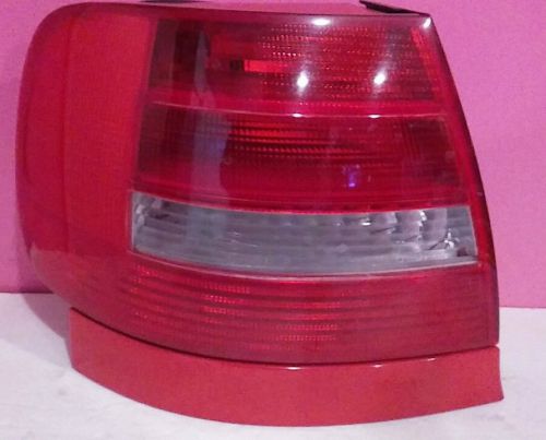 98 99 audi a4 drivers left tail light with a red trim oem