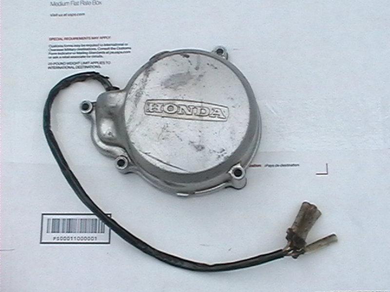 78-79 honda express moped parts: 1 stator/generator & 1 silver cover.