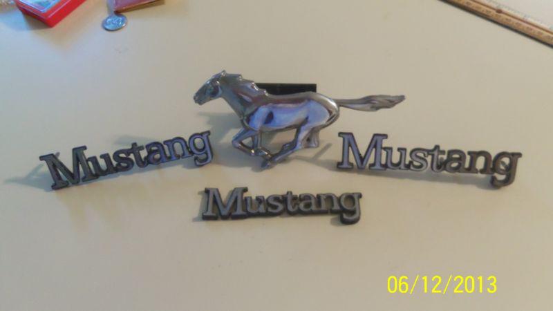 Ford mustang running horse & 3  words "mustang" emblems