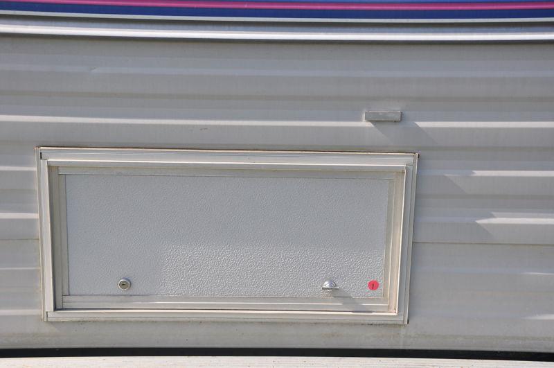 Used 26 x 12 1/2  compartment door horse trailer toy hauler& rv with key