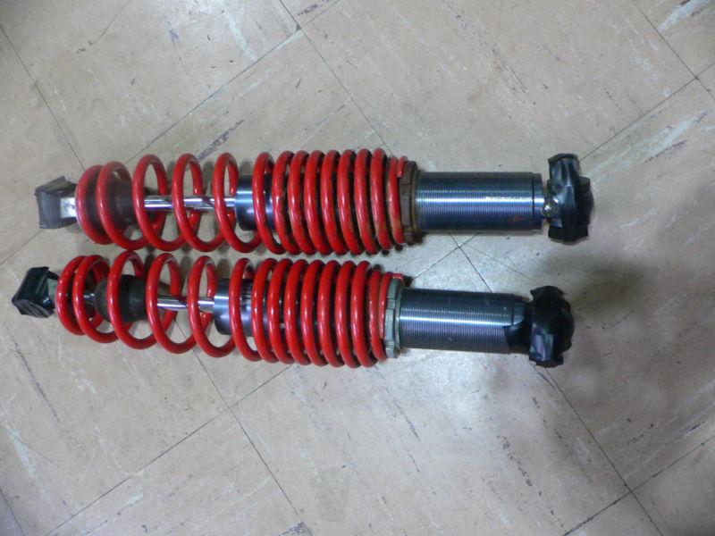 Polaris edge ryde fx rebuildable shocks with springs and bolts shown.