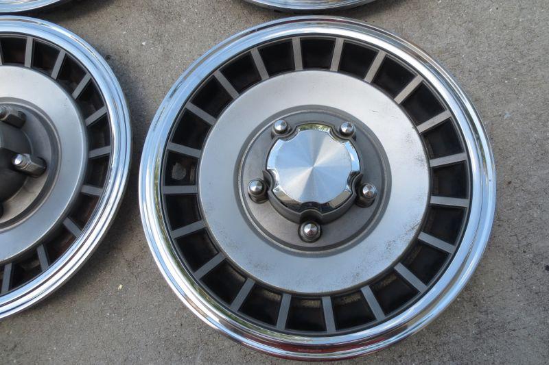 Ford 15" hubcaps~set of four~part#e7ta-1130-ga w/chrome center caps~yrs 79 to 96