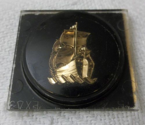 1953 plymouth interior door plastic emblem with mayflower design - gold on black