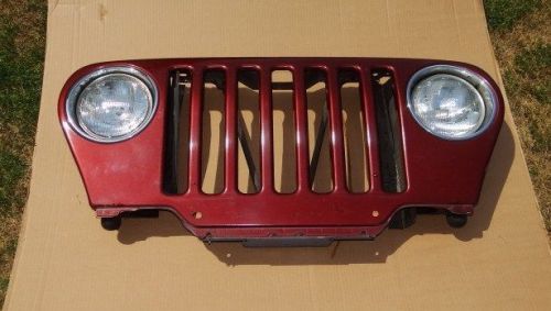 Jeep wrangler tj front grille, sienna red.  pu7  oem  97-06