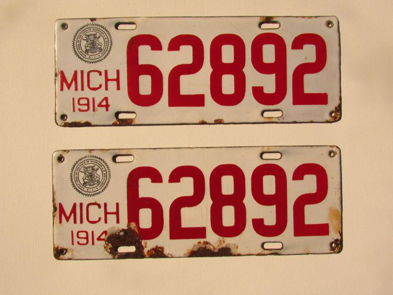 Antique1914 michigan license plates rare pair!! porcelain over iron very nice!!