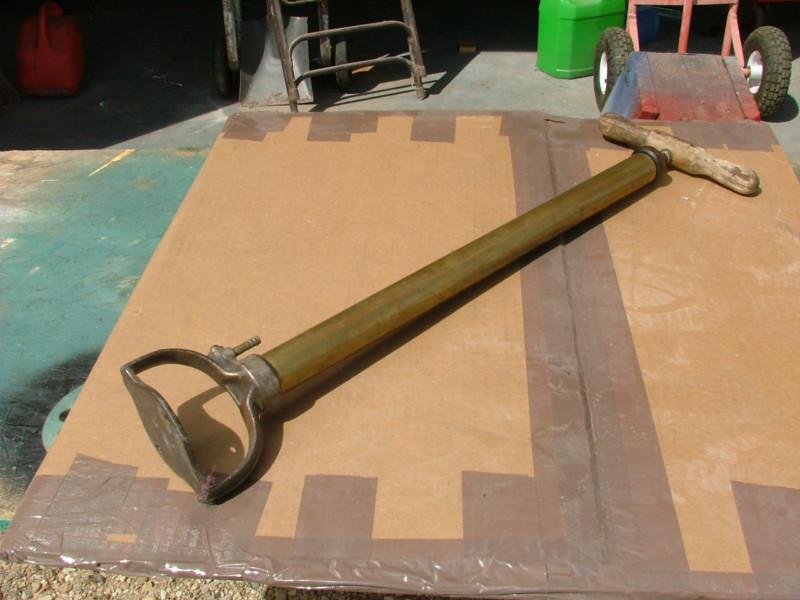 Old antique car hand tire pump, brass era model t ford