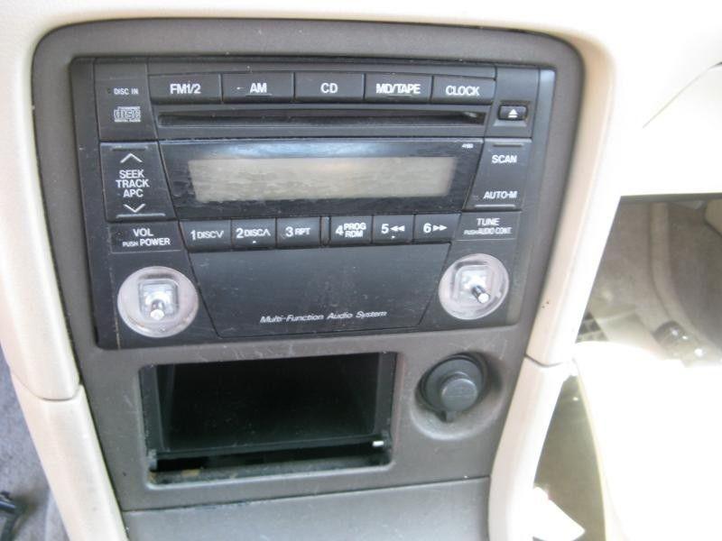 00 01 02 mazda 626 dash radio bezel surround trim panel tan