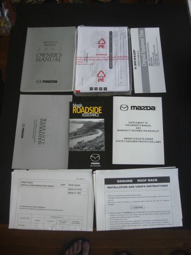 Owners manual with case and books 2002 mazda protege 02