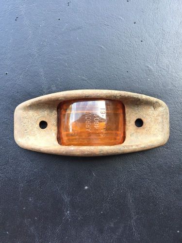 Vintage marker light  amber lens , arrow 4604. sae p 61 travel trailer tear drop