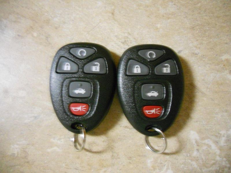 New !!,2013 gm/chevy impala keyless remote entry fobs,5 button remotes, lot of 2