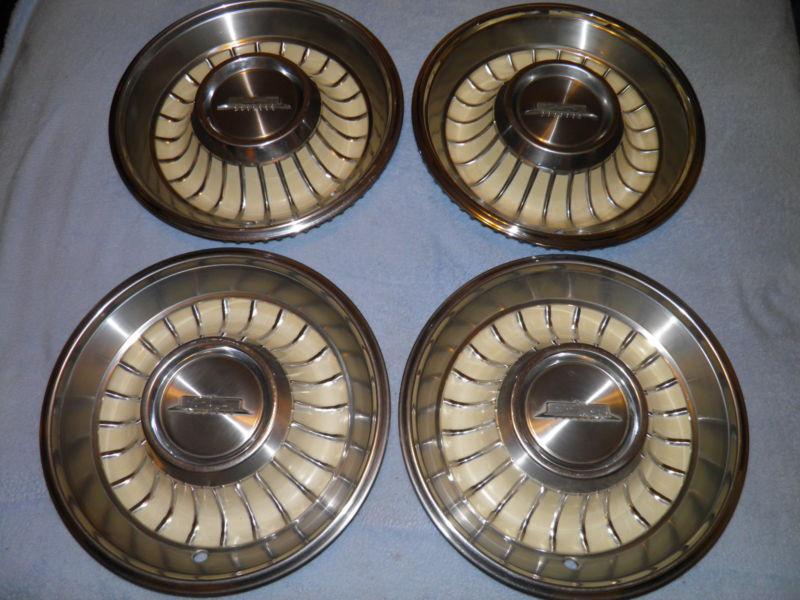 1962 cadillac mint set c5 nos 15" hubcaps wheelcovers 3 outstanding 1 sl damaged