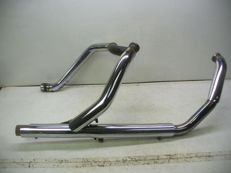 Harley 95 touring models oem dual exhaust pipes with crossover and heat shields.