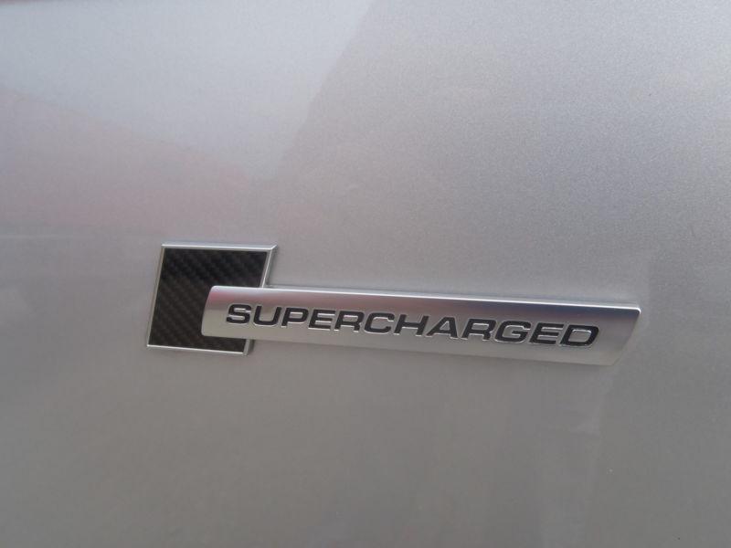 Audi supercharged emblem badge nameplate oem brand new 4f0853601 