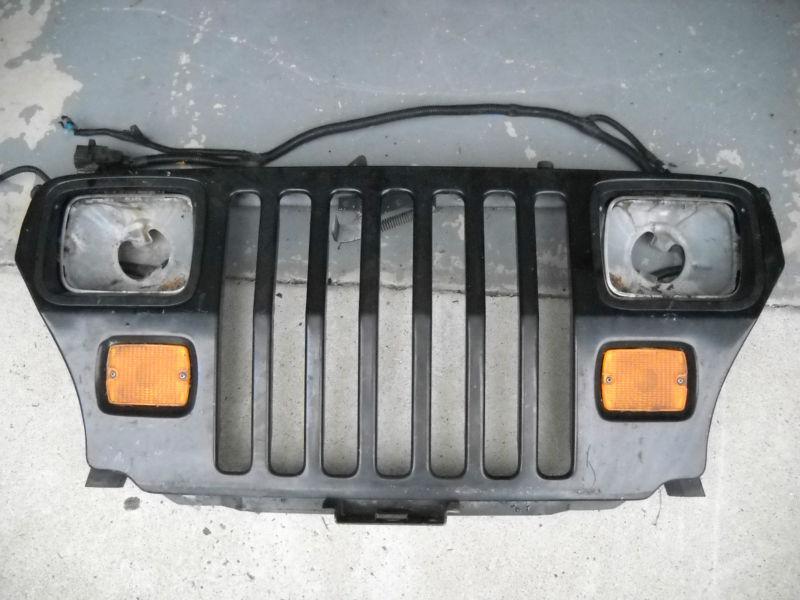 Jeep wrangler yj grille oem complete except headlights, has wiring harness