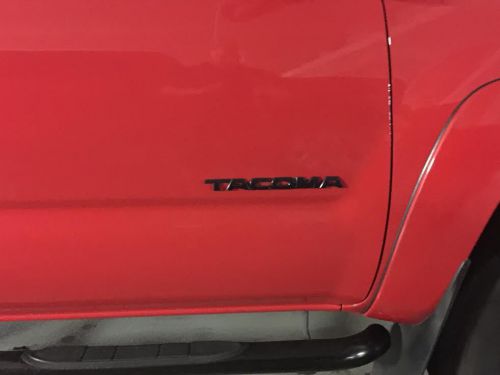 Toyota tacoma passenger side black door emblem oem 75427-04020-c1