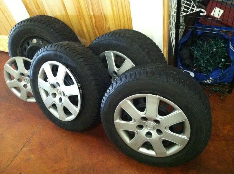 Studded snow tires, rims, and wheel covers fits mazda 3 etc.