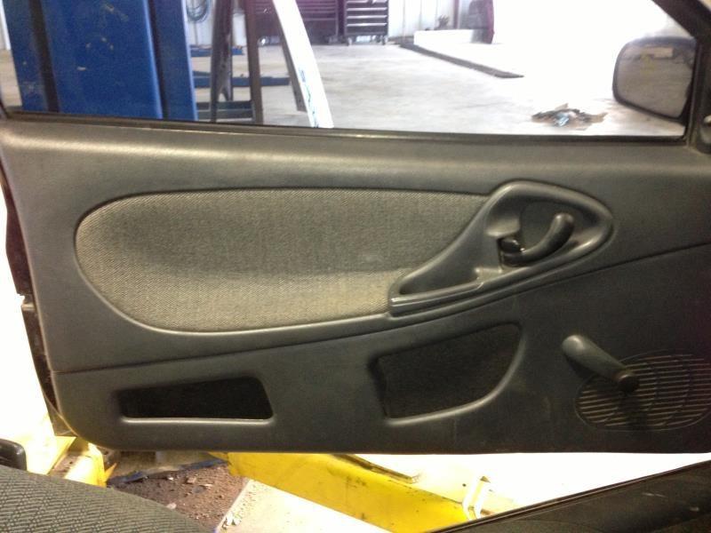 02 cavalier driver front door panel,manual,coupe,gray