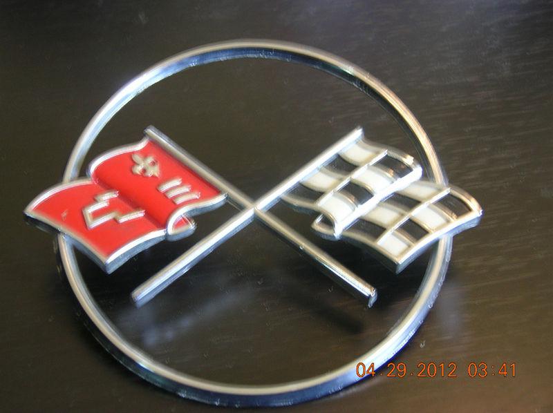 1962 corvette circular hood emblem. never on car