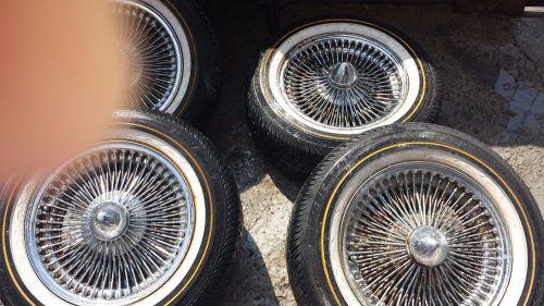 A set of 4 crome spoke rims with tires