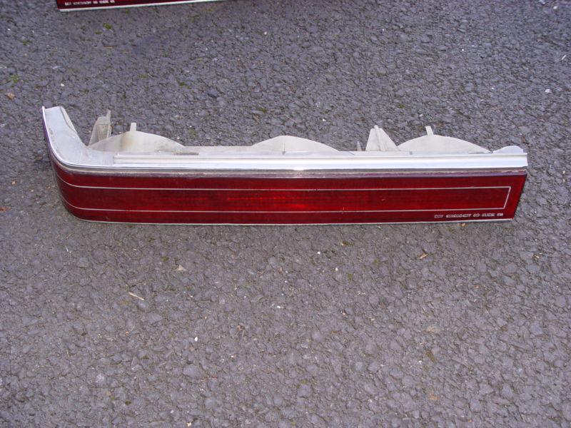 Nice clean left rear tail light assembly from a 1991 cadillac seville, lqqk !!!