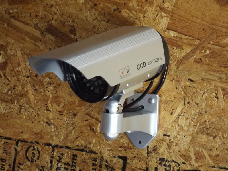 Security camera decoy with flashing led lights